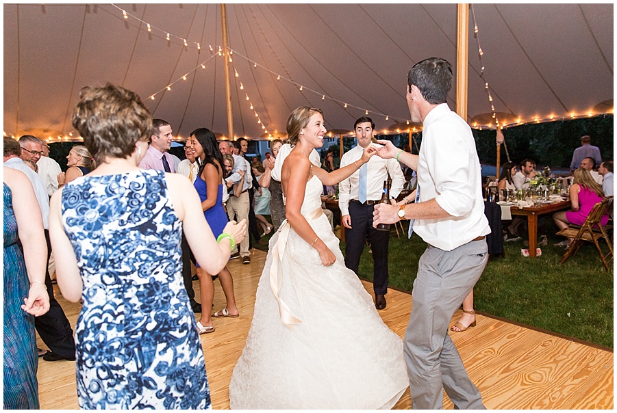 dancing under the white tent at wedding reception 