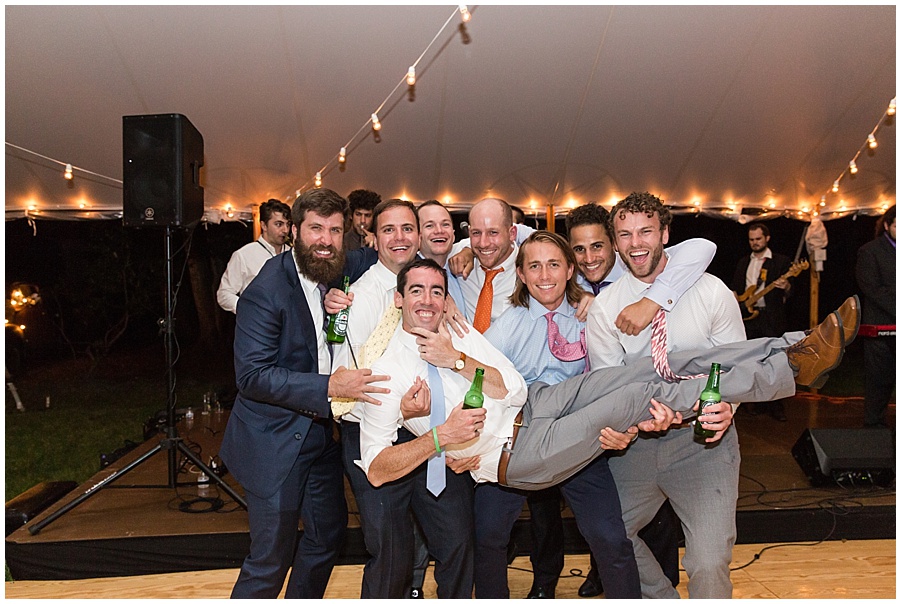 groom gets picked up by friends at wedding reception