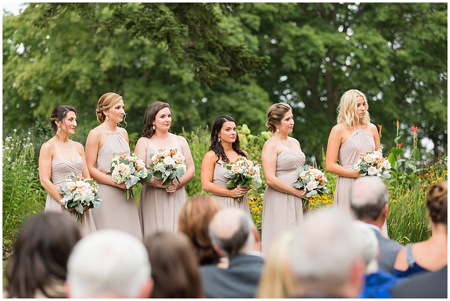 Bridesmaids stand at Glen Manor during ceremony