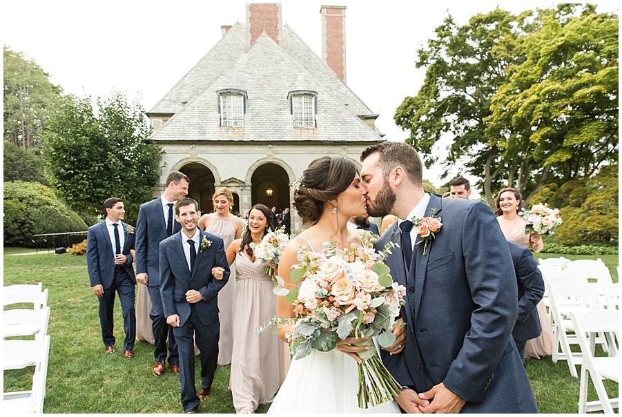 Bride and groom kiss on Glen Manor lawn 