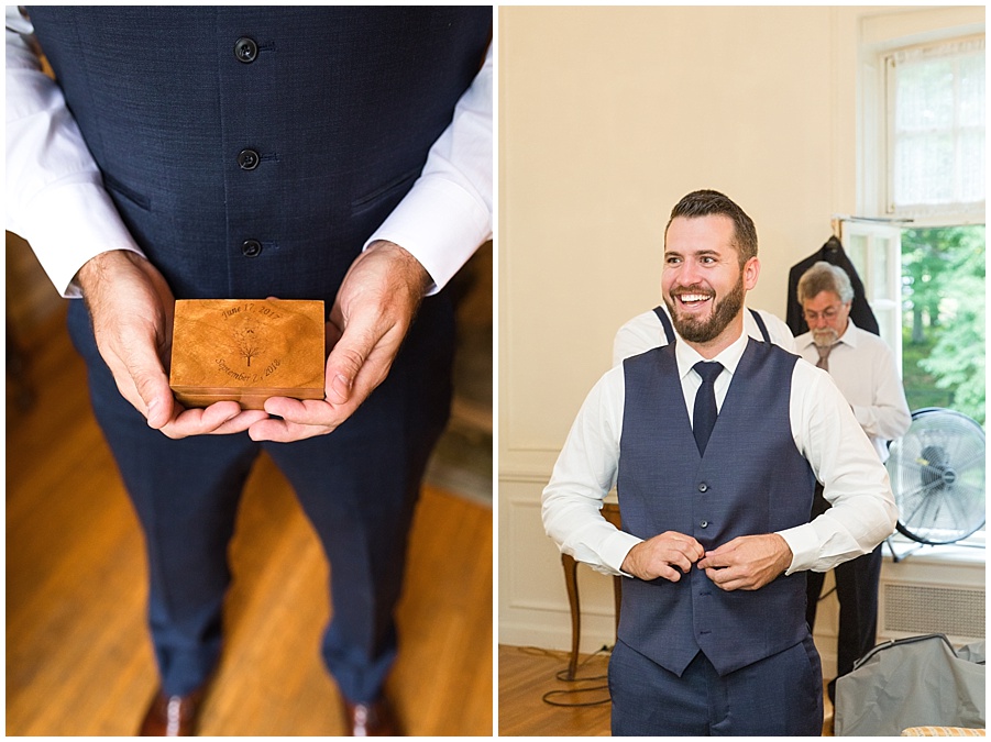 Groom adjusts suit jacket and ring box 