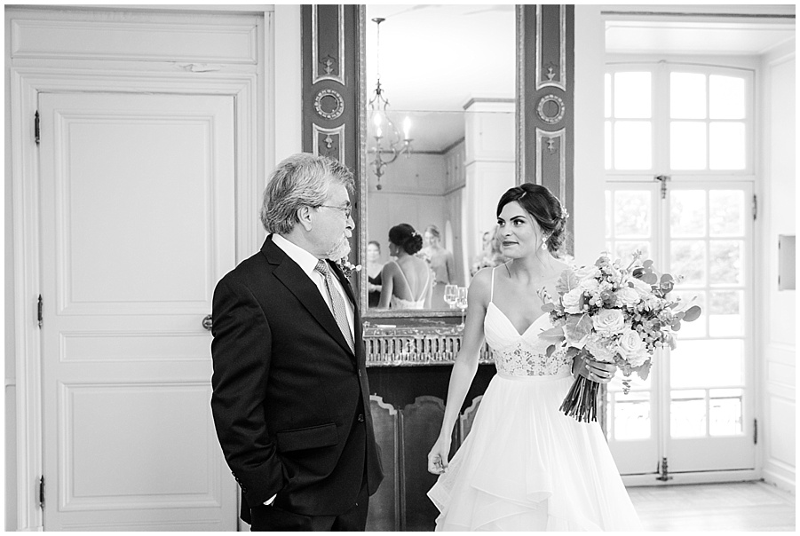 Bride and father of the bride see each other for a tearful hello