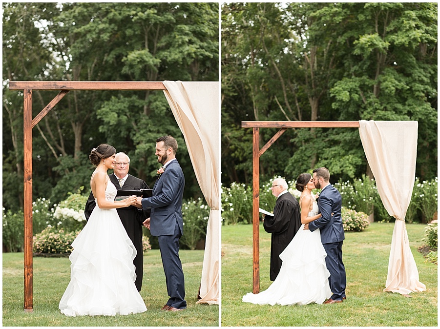 Bride and Groom stand under arbor saying their vows at Glen Manor