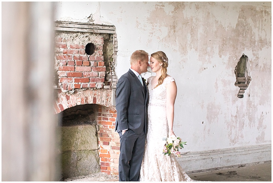 bride and groom inside Fort Adams for formal photos 