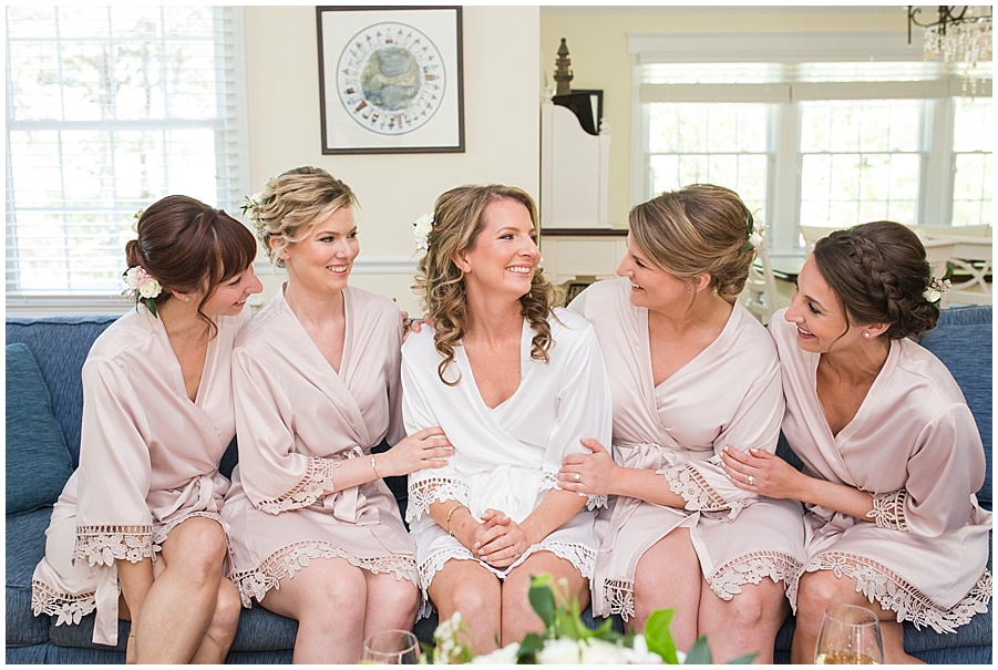 bride and bridesmaids in pink robes 
