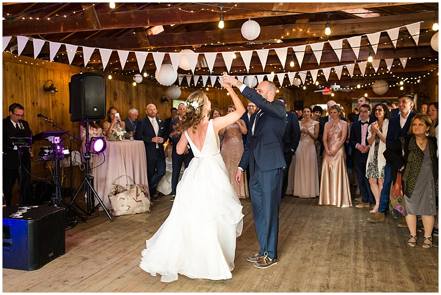 bride and groom share first dance at chequessetts boathouse
