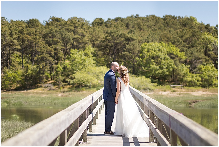 bride and groom share first kiss at Uncle Tim's Bridge in Wellfleet