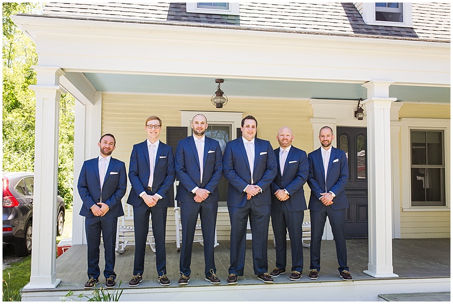 Groom and Groomsmen getting ready in navy suits 