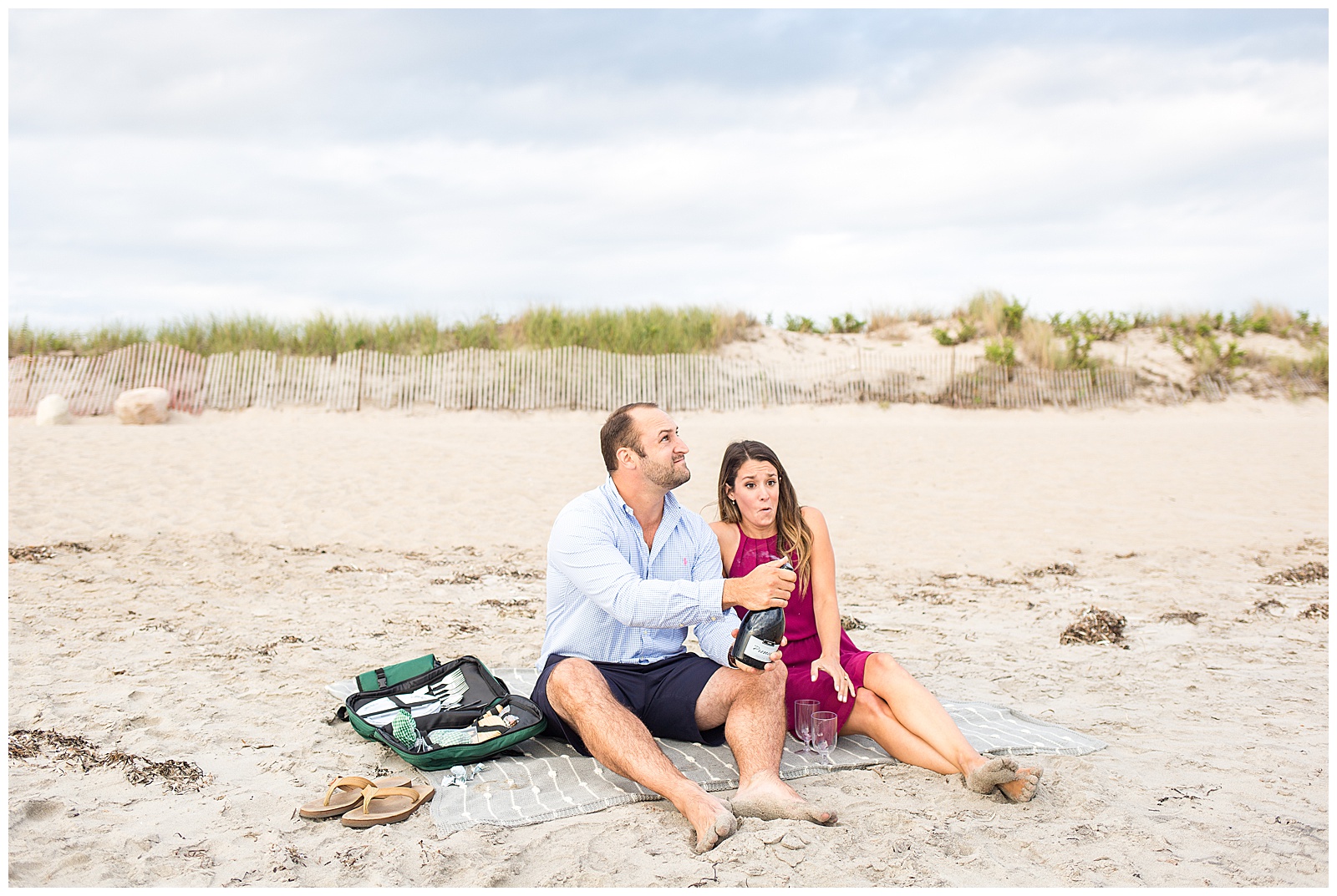 beach engagement session with champagne