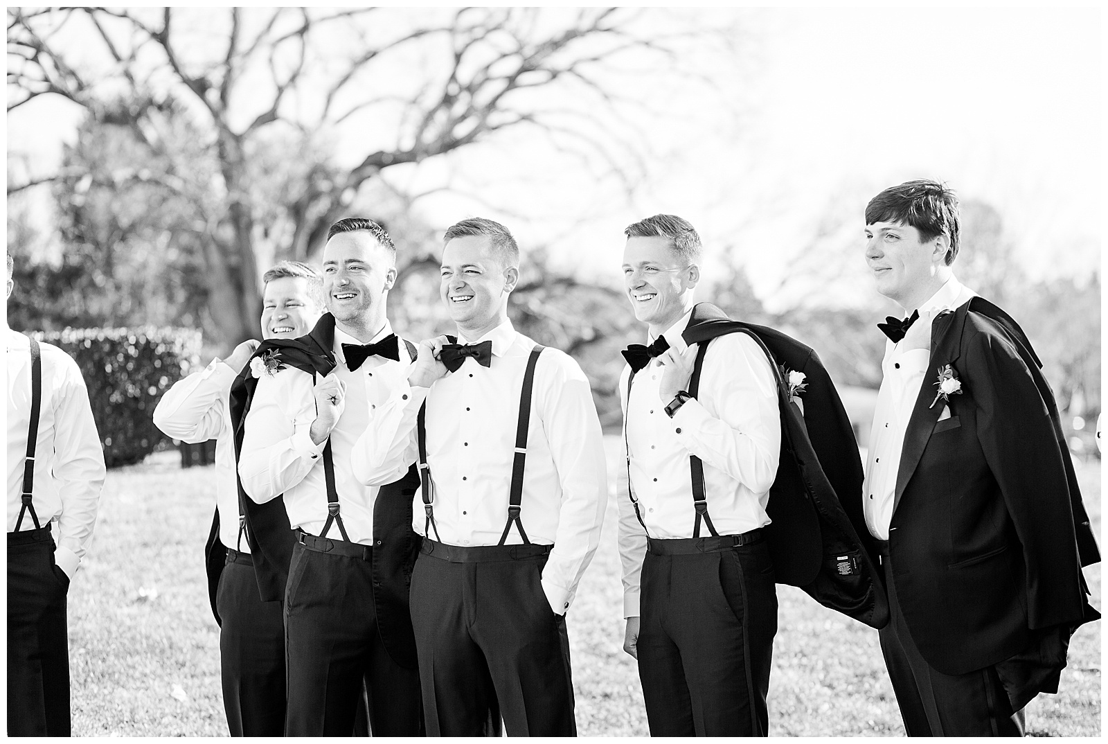 Groomsmen pose on the lawn at Brae Burn Country Club