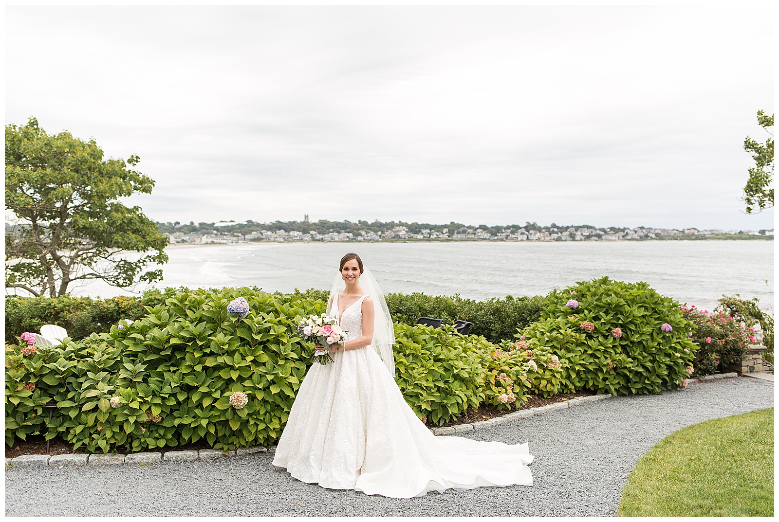 Bride poses by the ocean at the Chanler resort