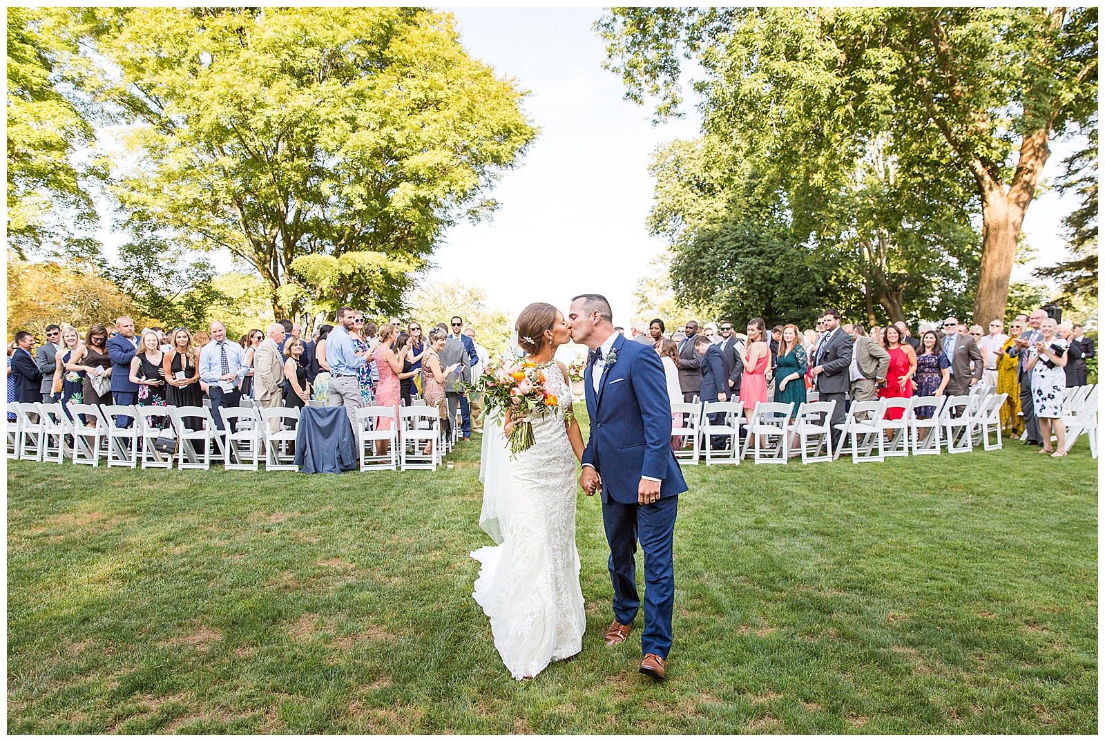 just married! bride and groom walk down aisle at Glen Manor