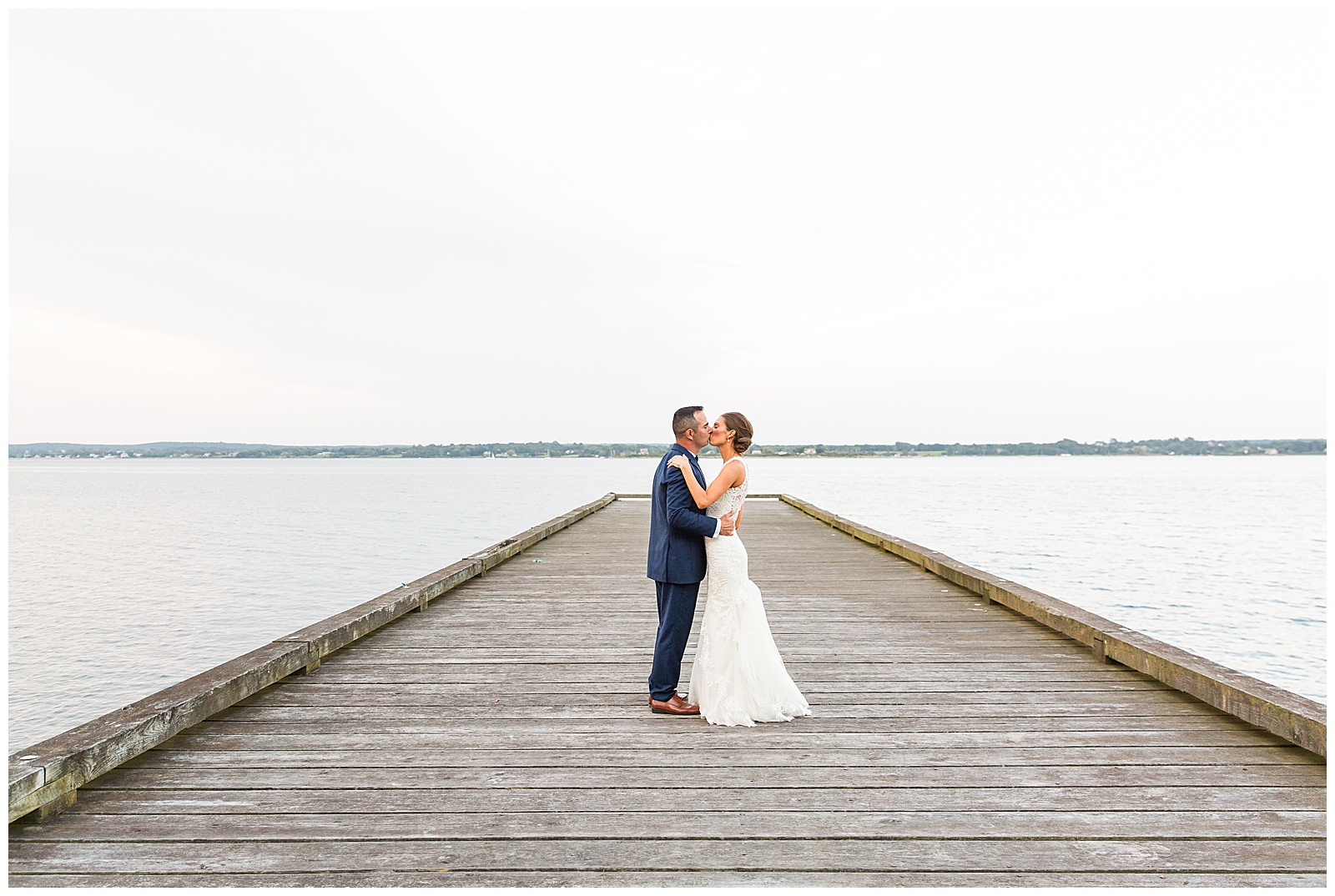 bride and groom kiss on the dock at Glen Manor House wedding