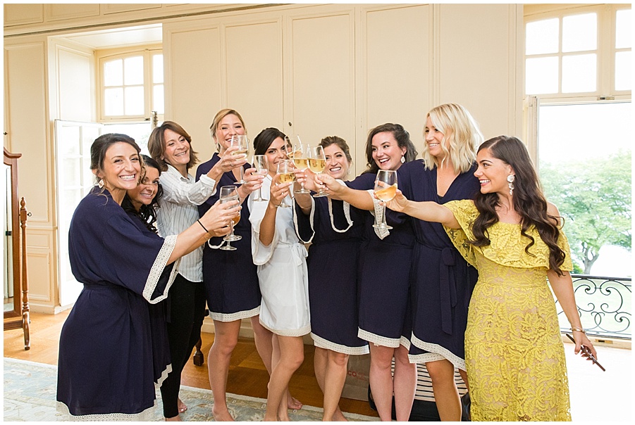 Bride and bridesmaids toast champagne