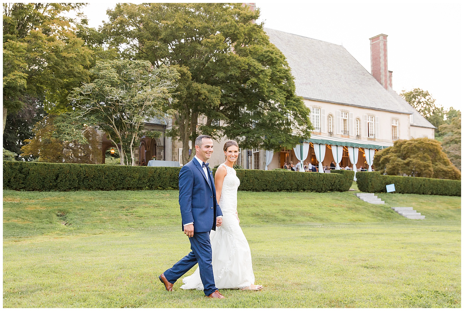 bride and groom walk along the grounds at Glen Manor